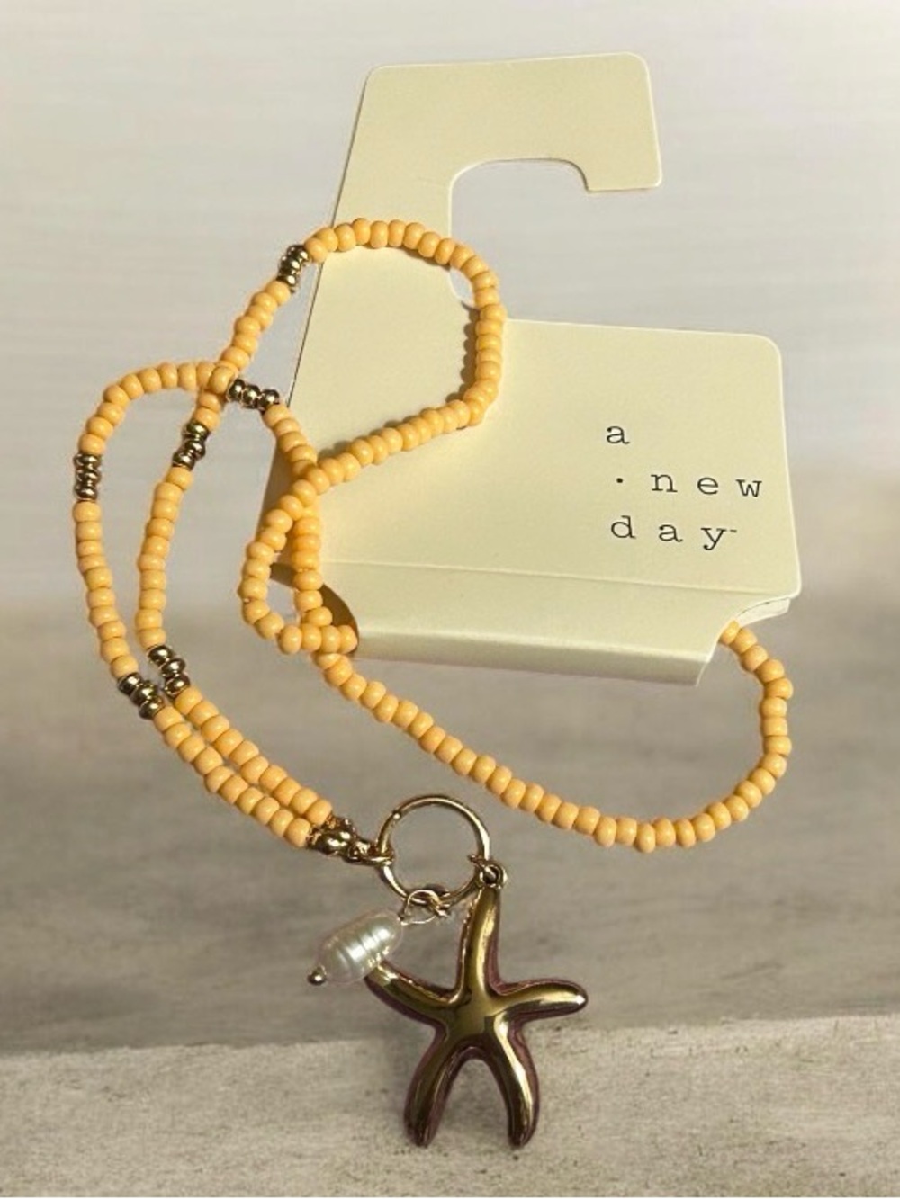 a new day Yellow Beaded Necklace with Gold Starfish and Pearl Charm
